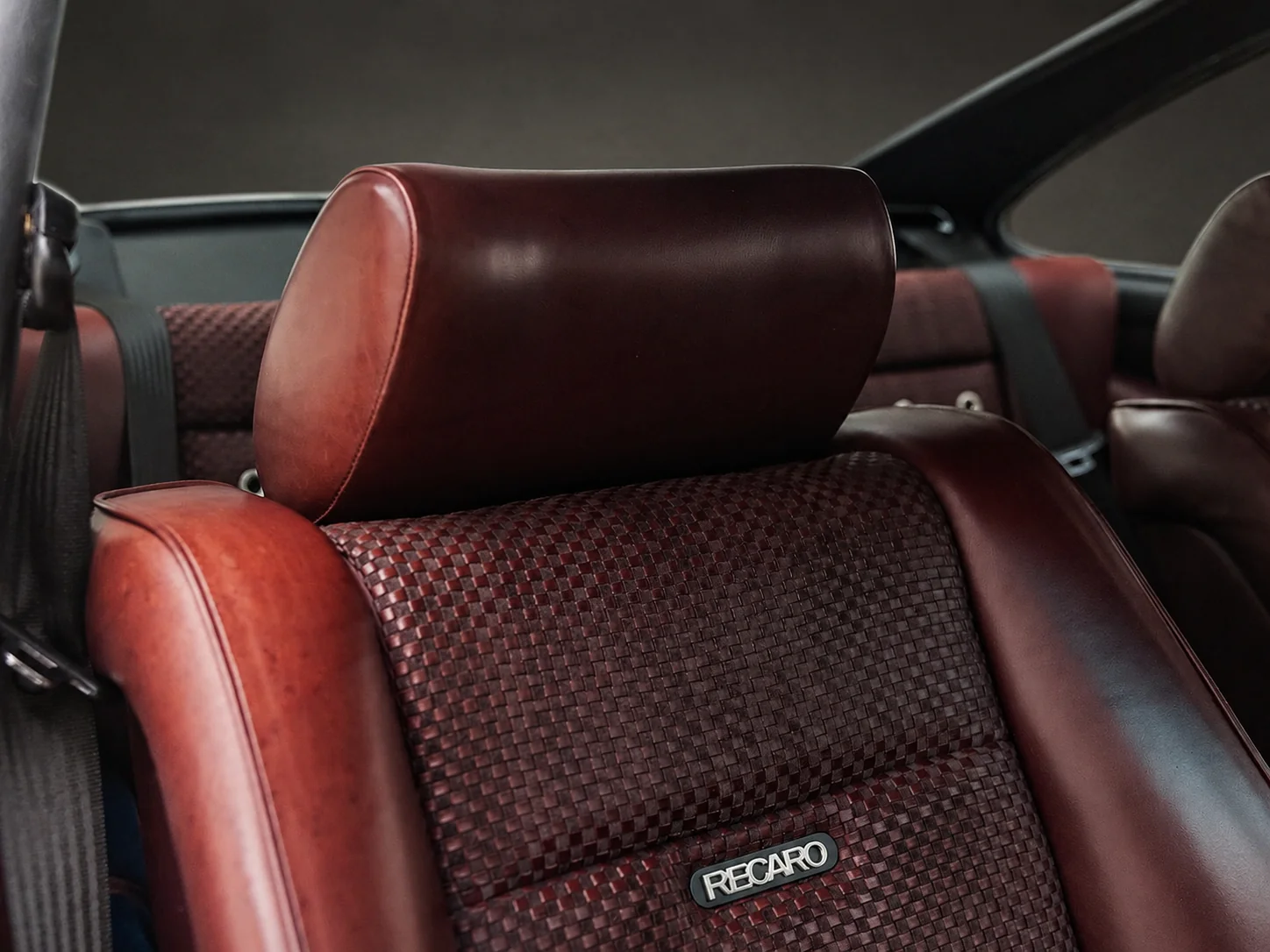 Alabaster contrast stitching on the Dark Blackberry leather