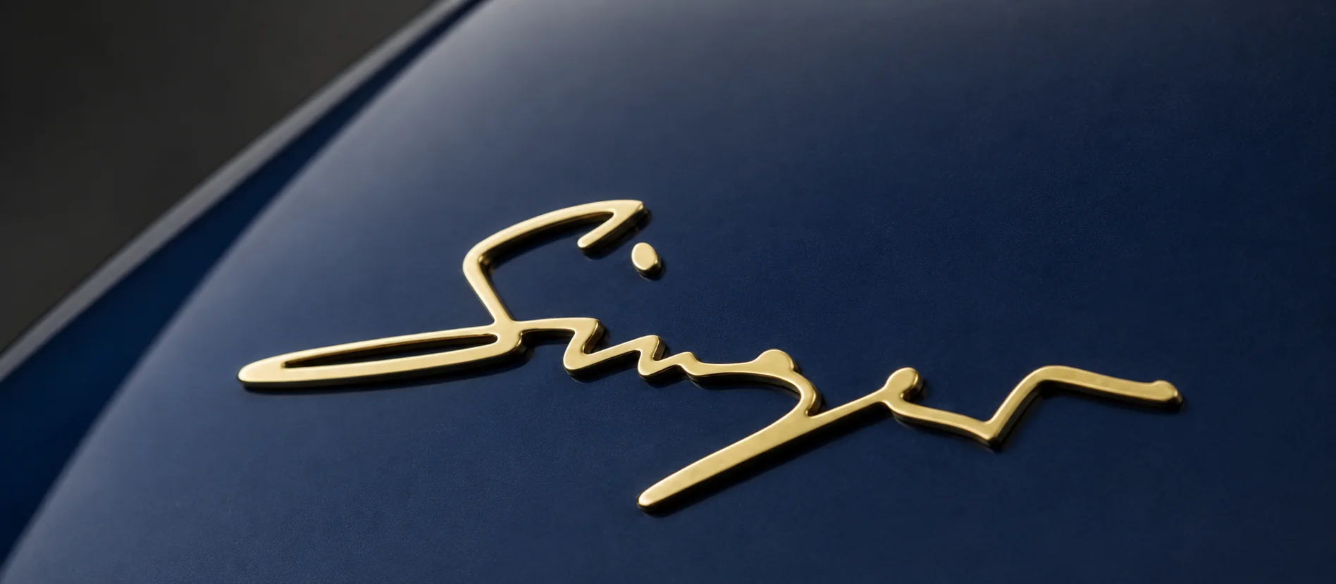 Singer badging, applied by hand